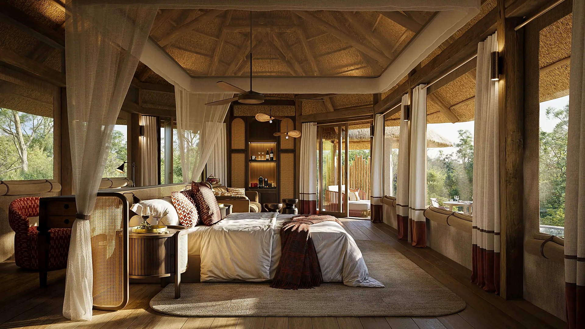 A luxury tented suite deck overlooking a delta channel at golden hour in Botswana