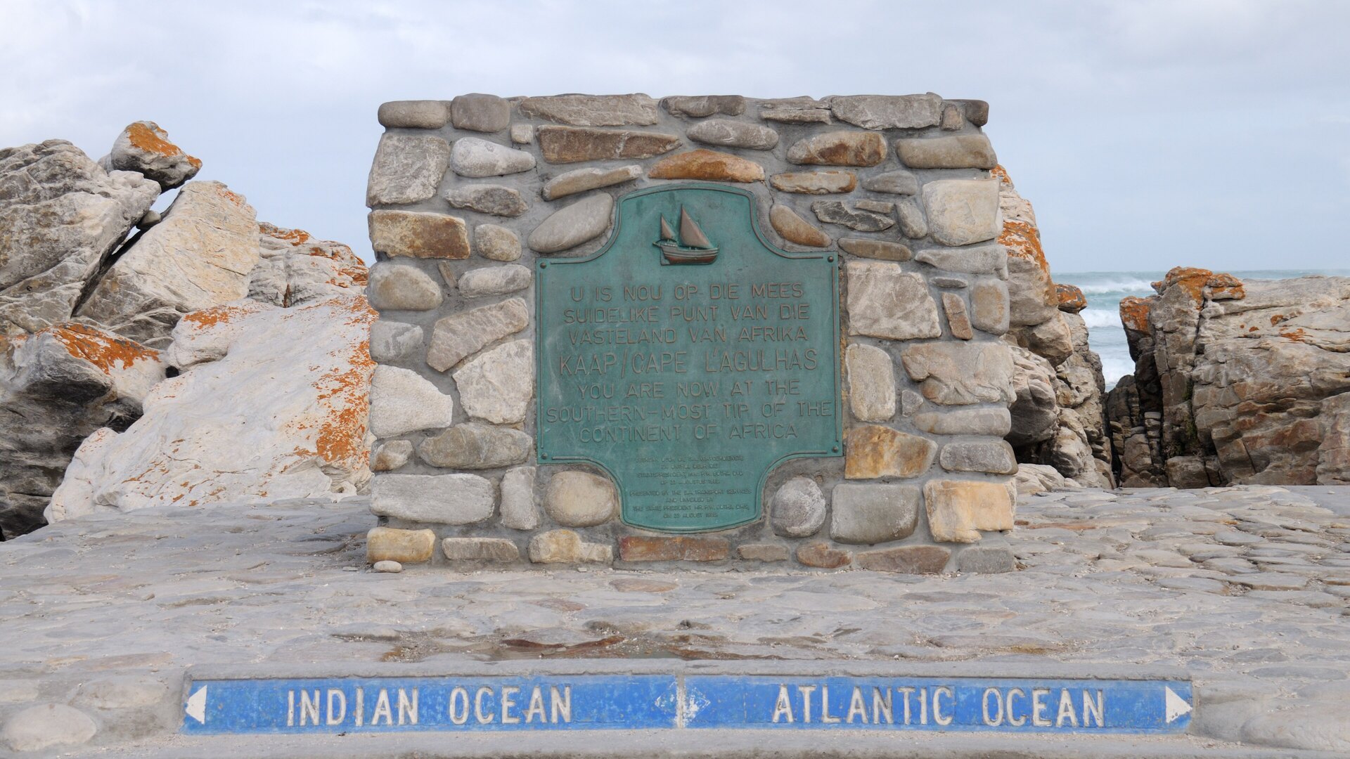 The stone cairn and Atlantic/Indian Ocean directional marker at Cape Agulhas, the southernmost tip of the African continent