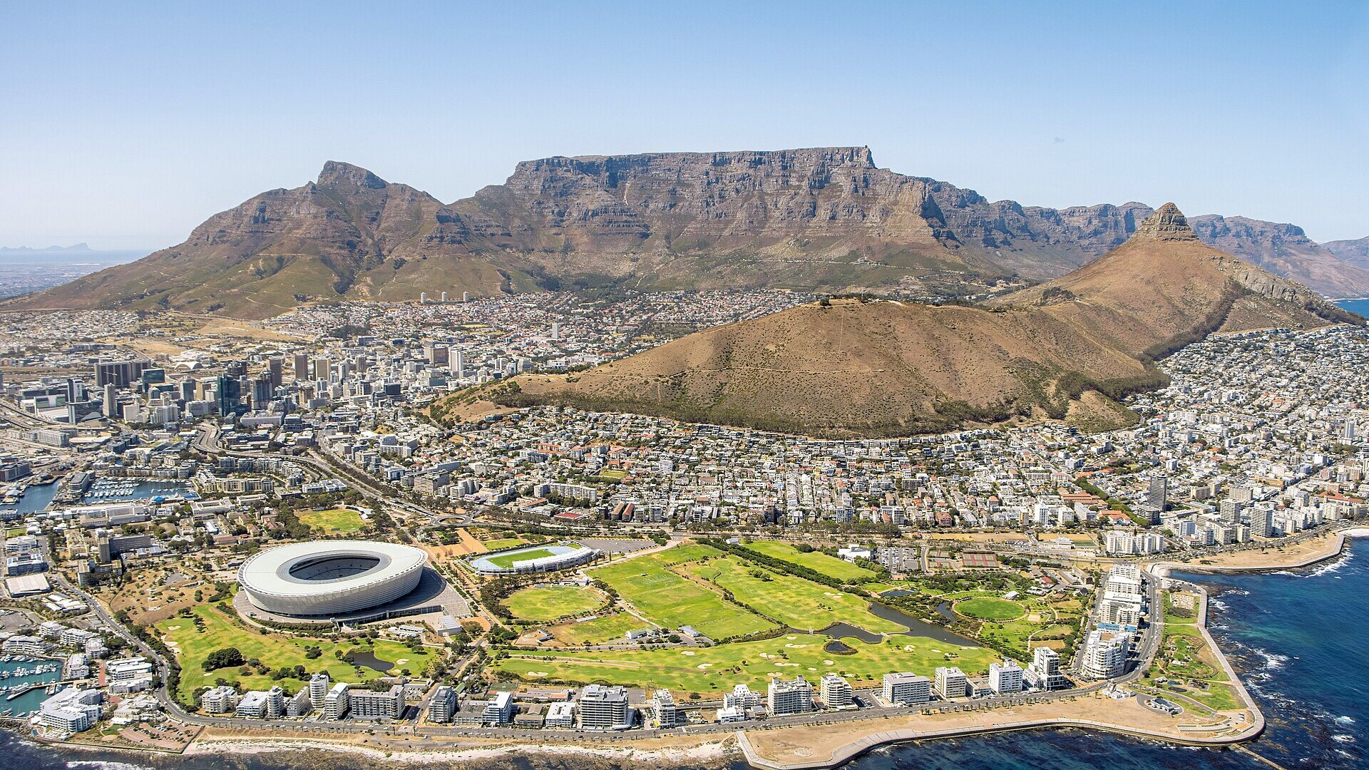 Aerial view of the Cape Peninsula coastline and mountains from a helicopter over Cape Town