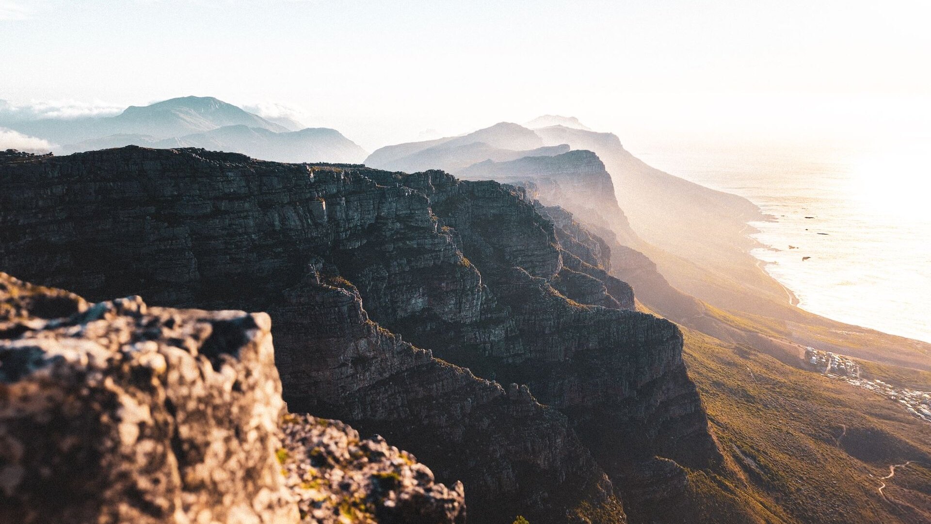 Table Mountain rising above Cape Town and the Atlantic seaboard at golden hour