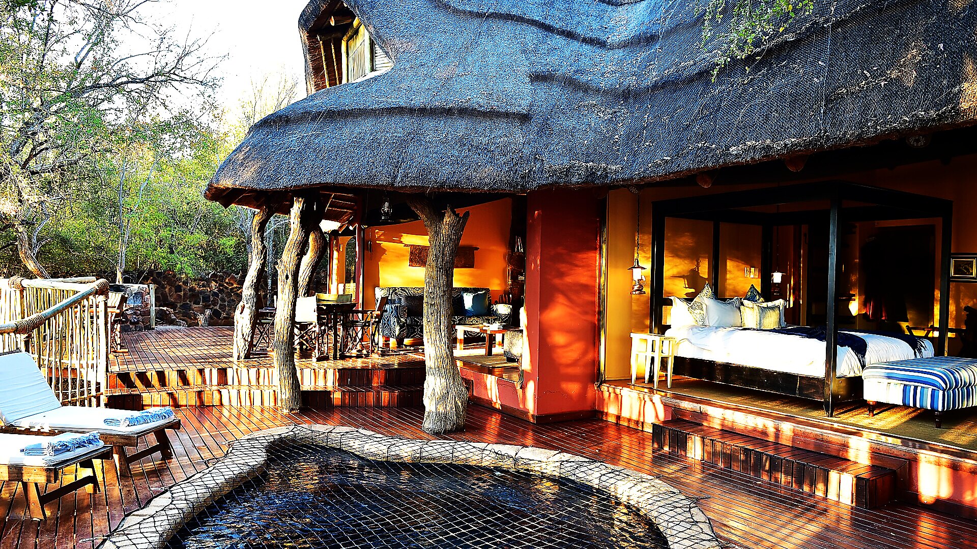 Thatched riverside lodge with pool at Chongwe River Camp, Lower Zambezi