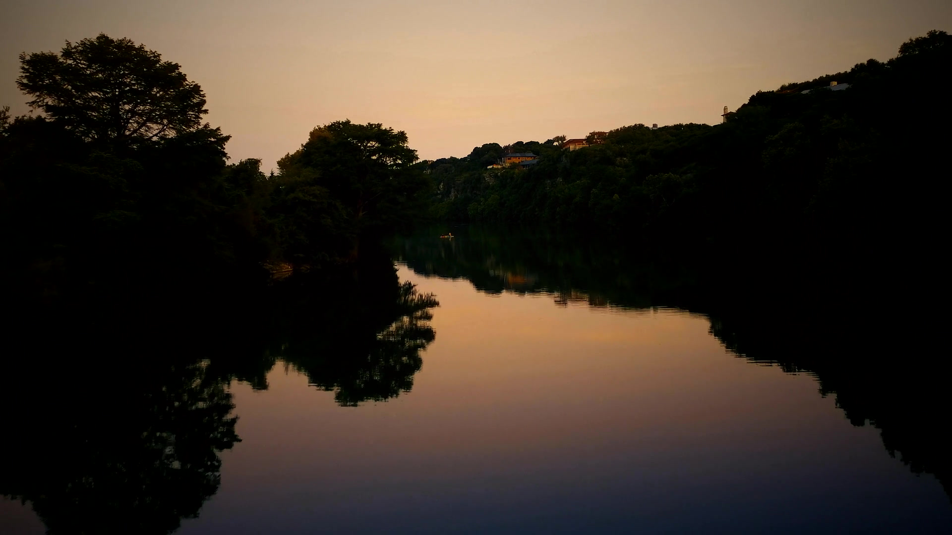 River flowing through lush Congo rainforest landscape at dusk — gateway to the Republic of the Congo's hidden natural wonders