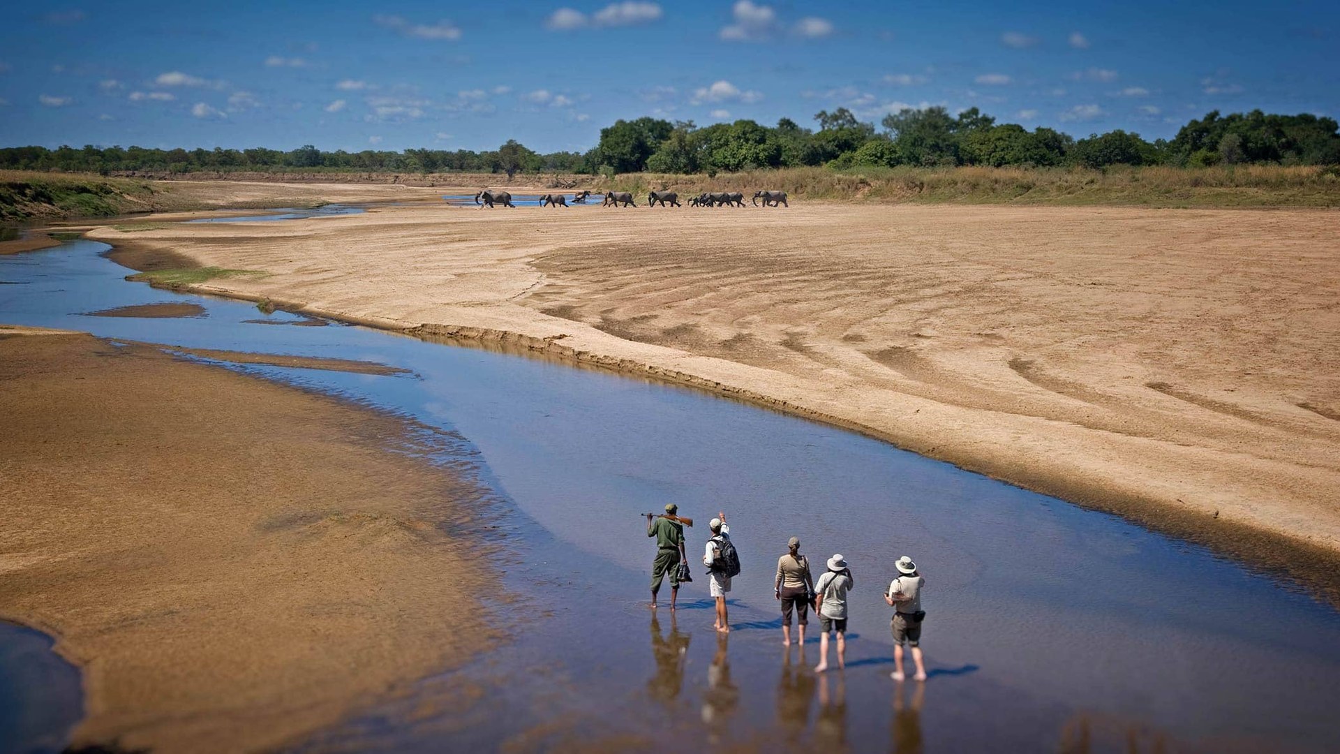 A family game drive beside the Luangwa river on a Zambia family safari