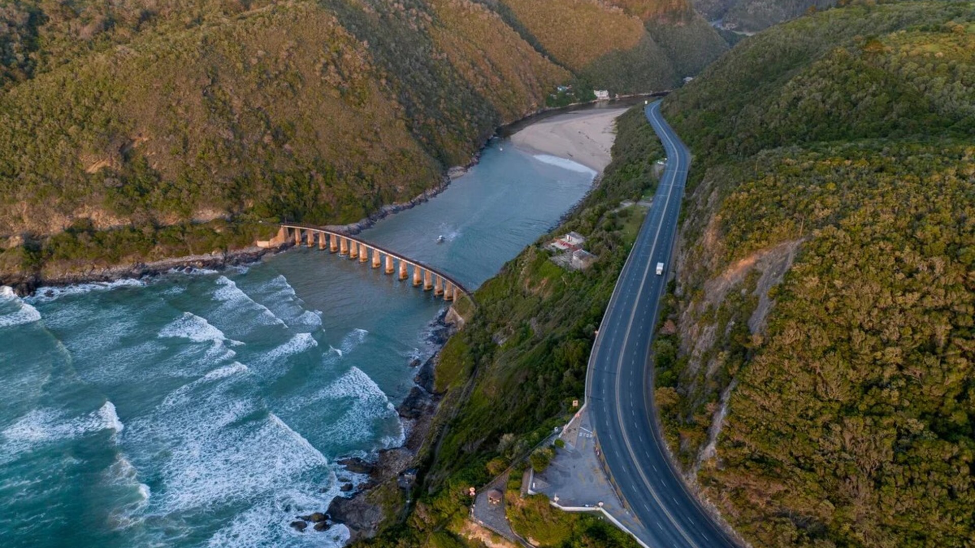The Kaaimans River rail bridge and forested coast on a Garden Route tour package in South Africa