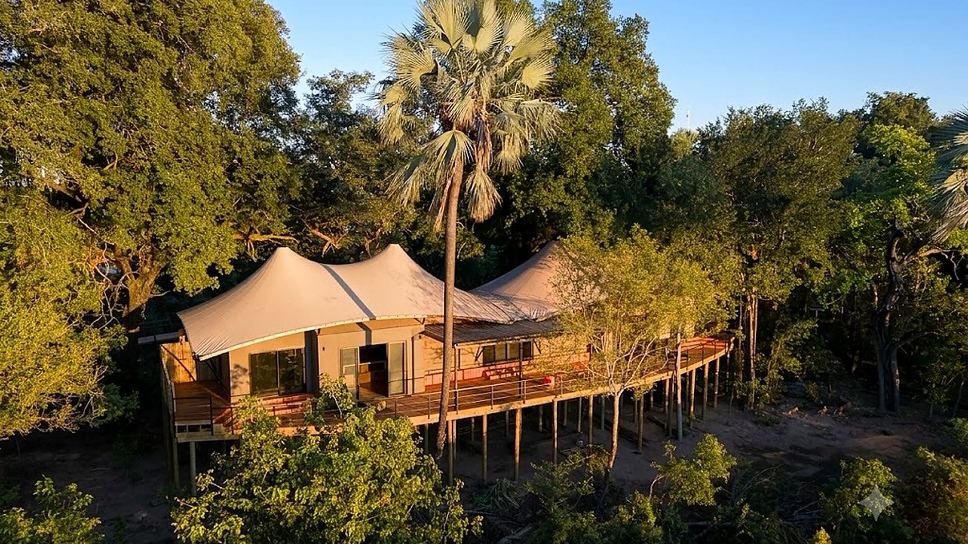 A raised luxury safari suite on an exclusive private concession at golden hour — Top 10 Best high-end African safaris 2026 and 2027