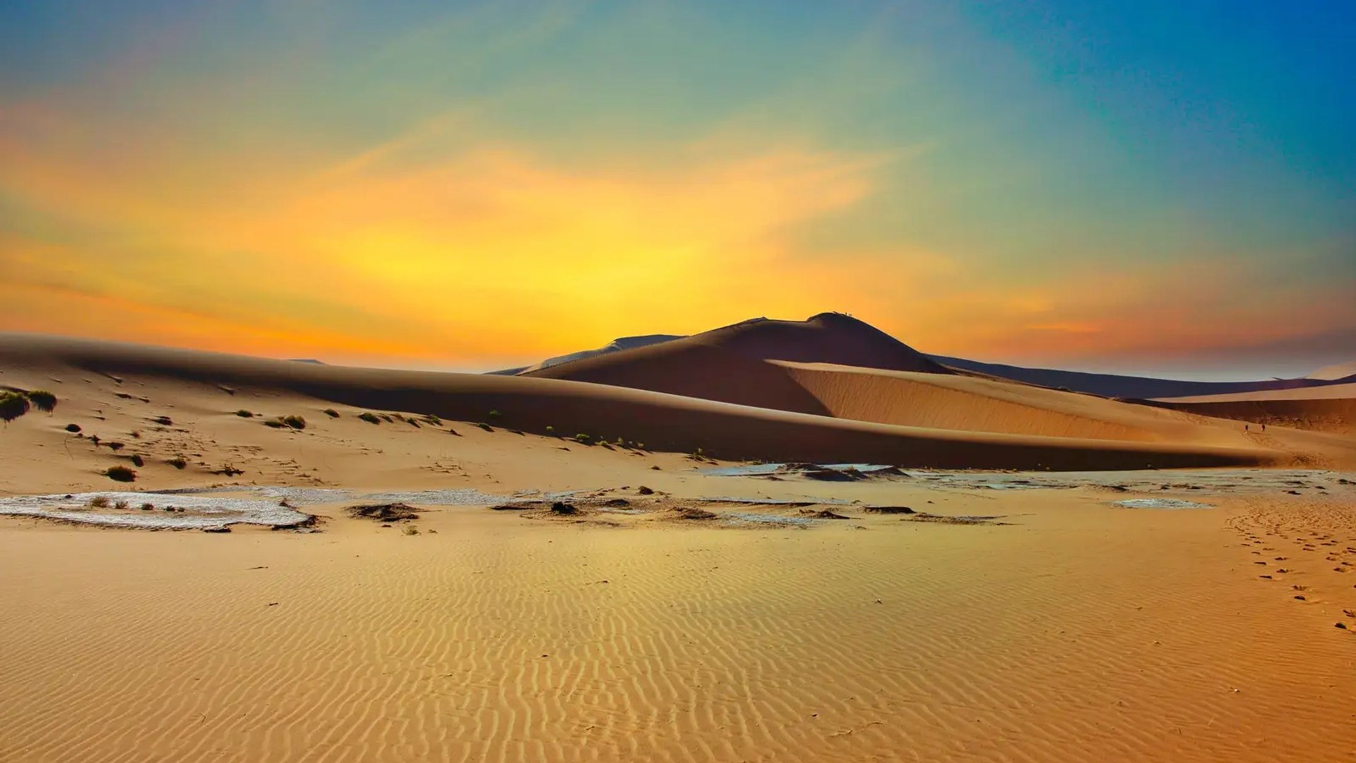 Red dunes of the Namib desert glowing at sunset on a Namibia honeymoon safari