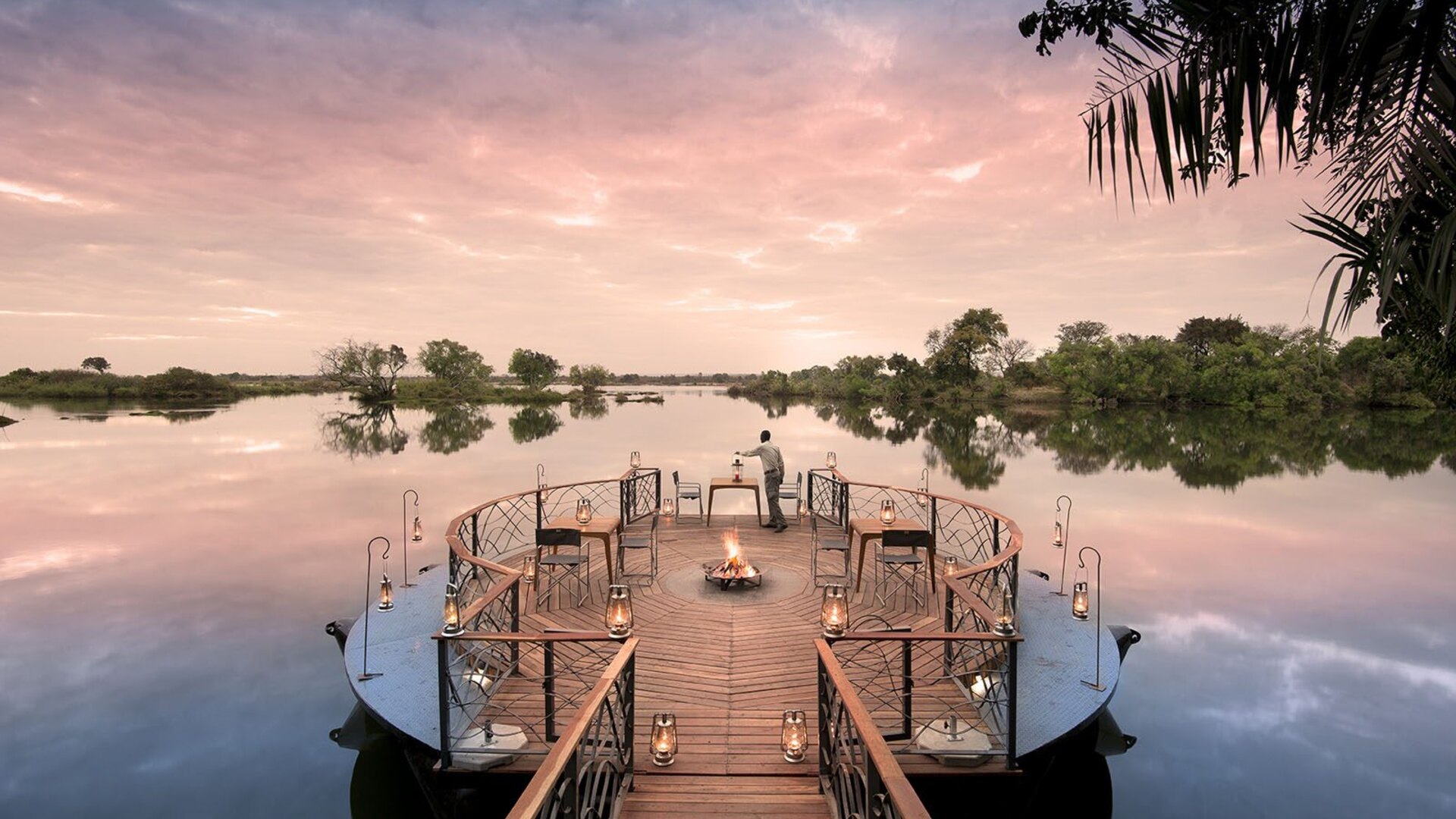 Golden-hour arrival at a flagship luxury safari lodge in Africa — the hallmark of a world-class safari company
