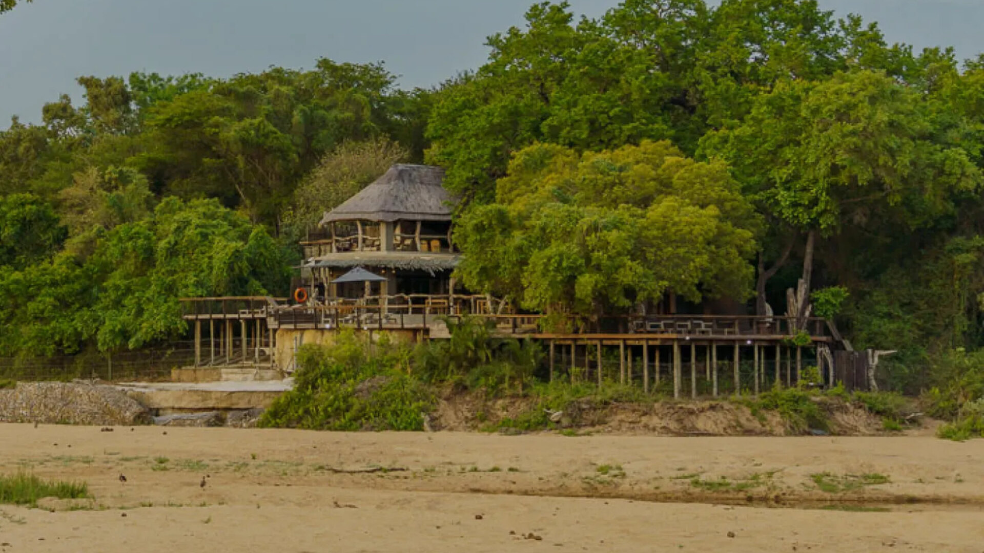 Jock Safari Lodge main building with round thatched roof set in the southern Kruger bush landscape