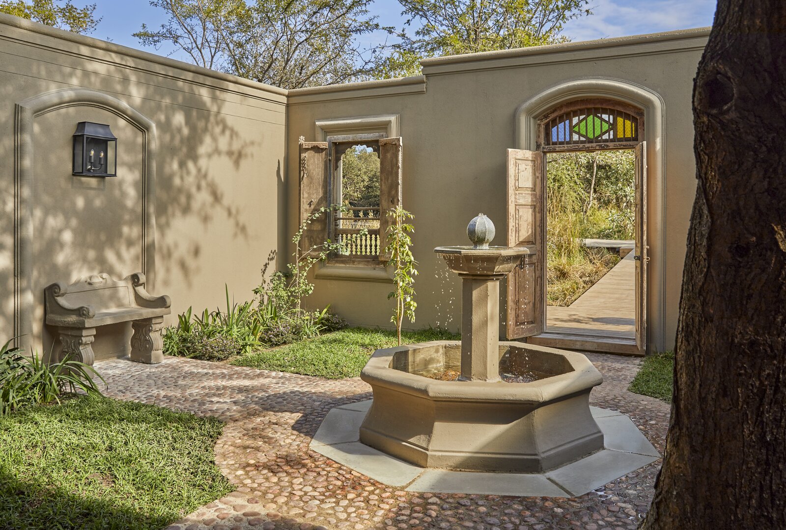 A luxury safari suite with a private deck and plunge pool overlooking the African bush