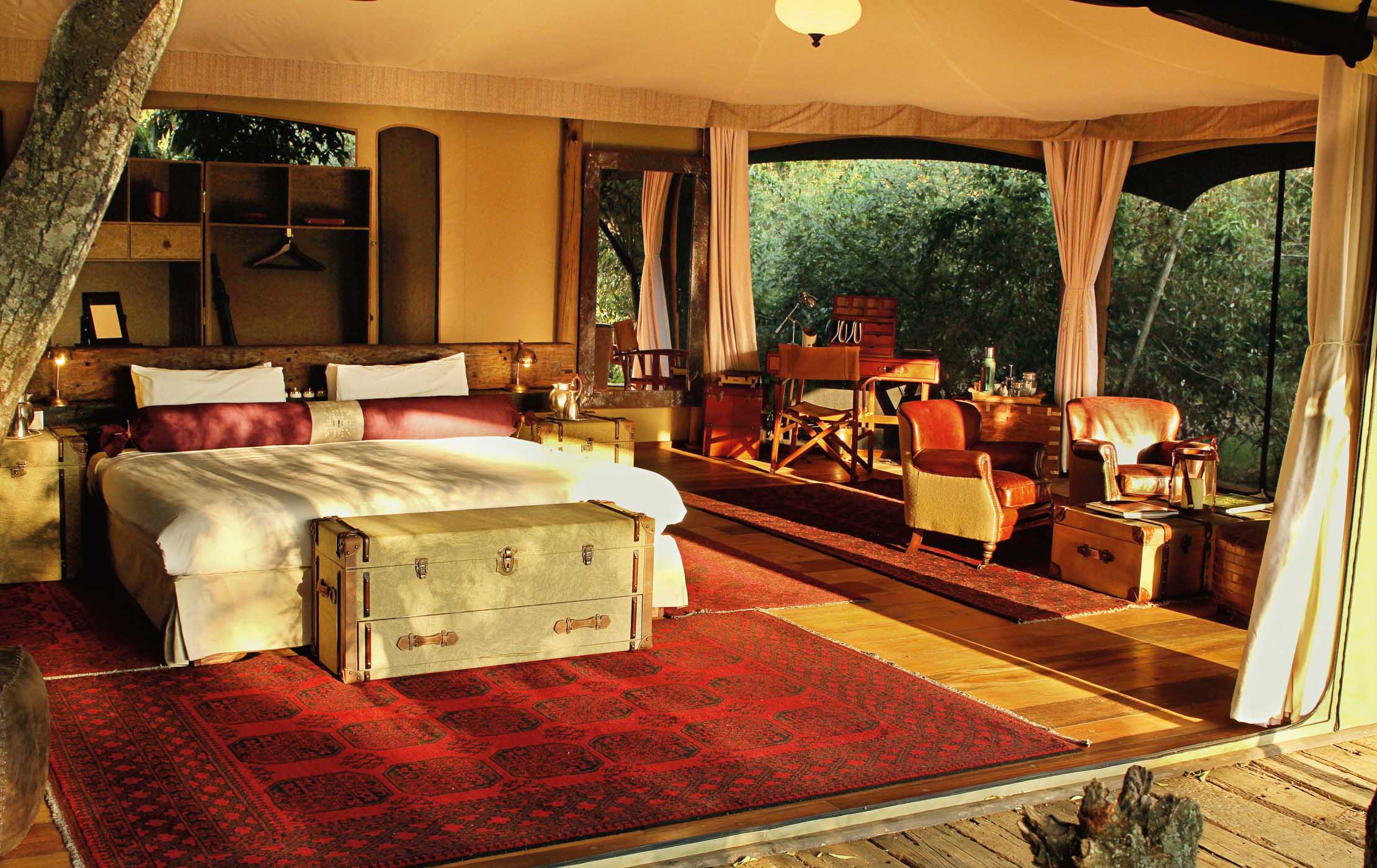 Mara Plains Camp raised luxury tent with copper bathtub overlooking the Olare Motorogi Conservancy plains at golden hour