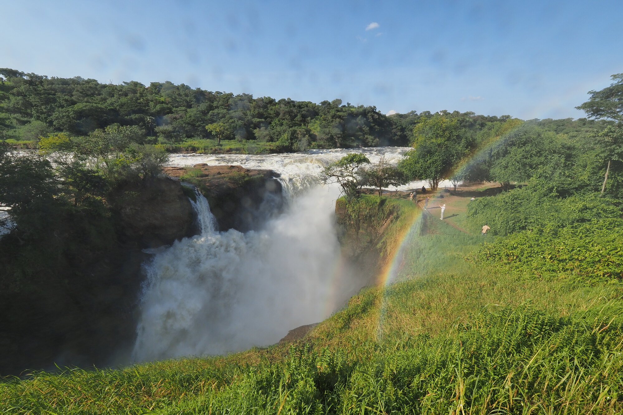 The Victoria Nile exploding through the seven-metre gorge at Murchison Falls, Uganda, with a rainbow in the spray — Murchison Falls safari packages