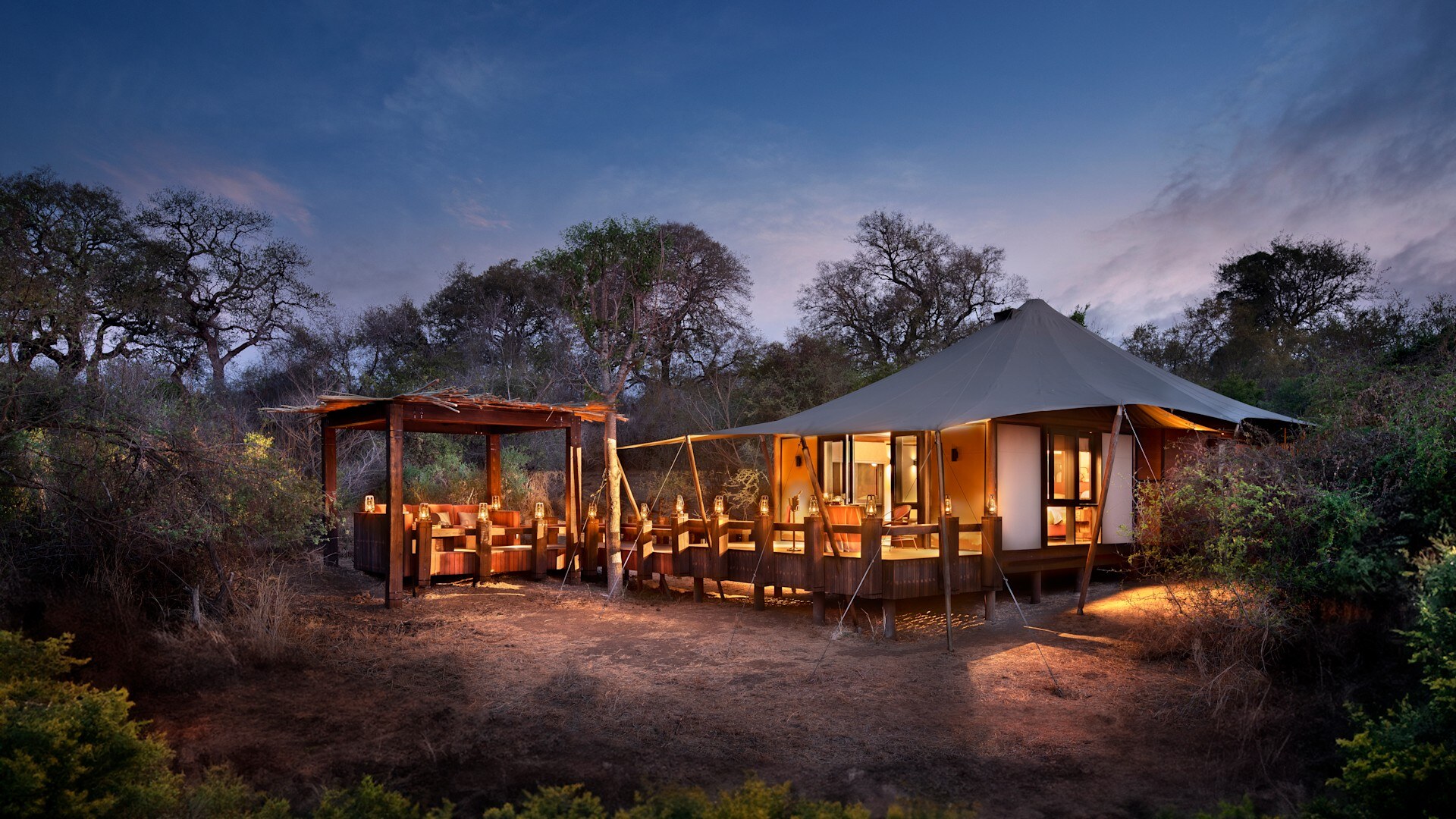 A luxury tented suite raised above the riverbank at andBeyond Ngala Tented Camp inside the Kruger National Park