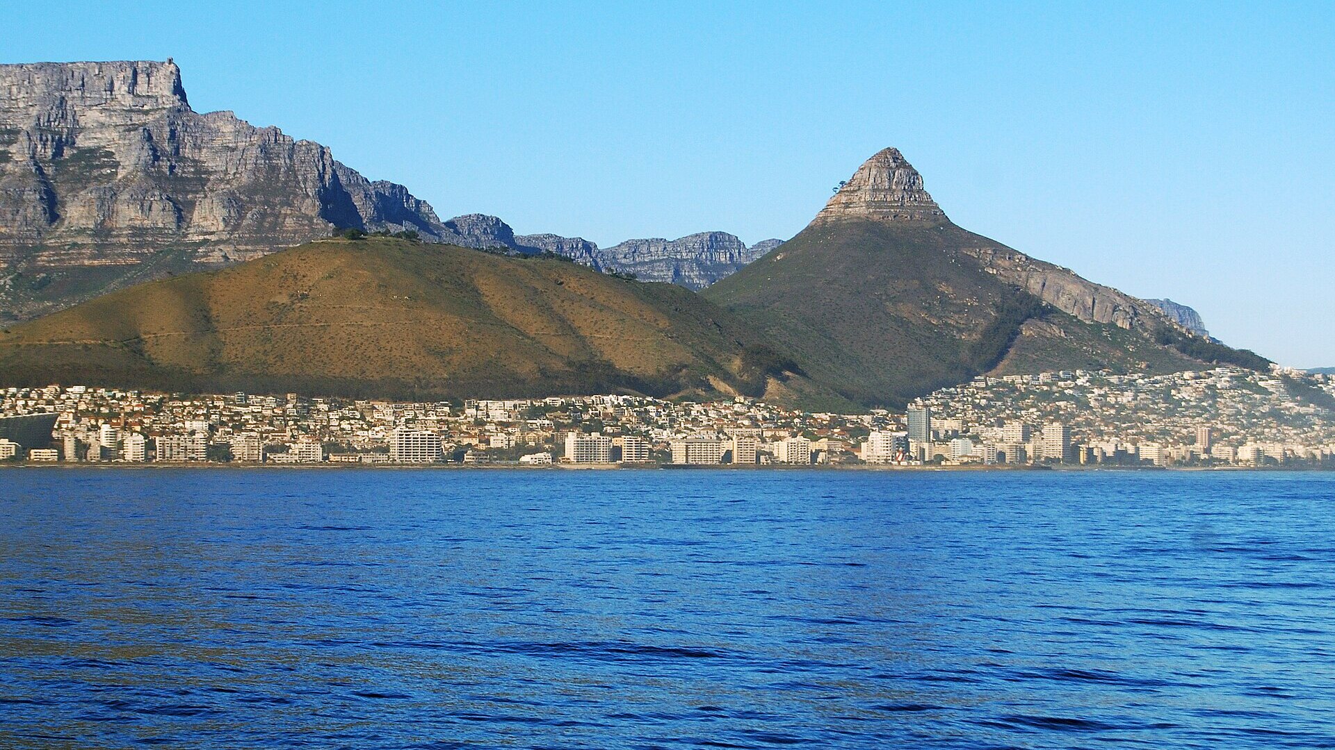 Robben Island seen across Table Bay with Cape Town and Table Mountain behind — Robben Island tickets and tours