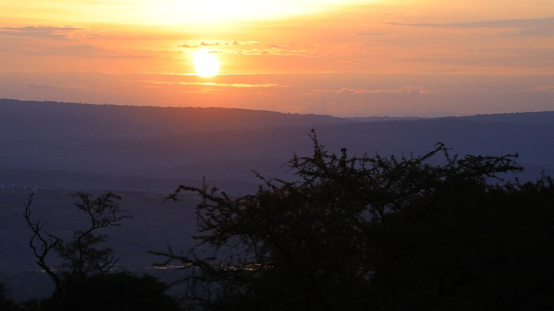 Golden-hour light over the savannah and lakes of Akagera National Park, Rwanda