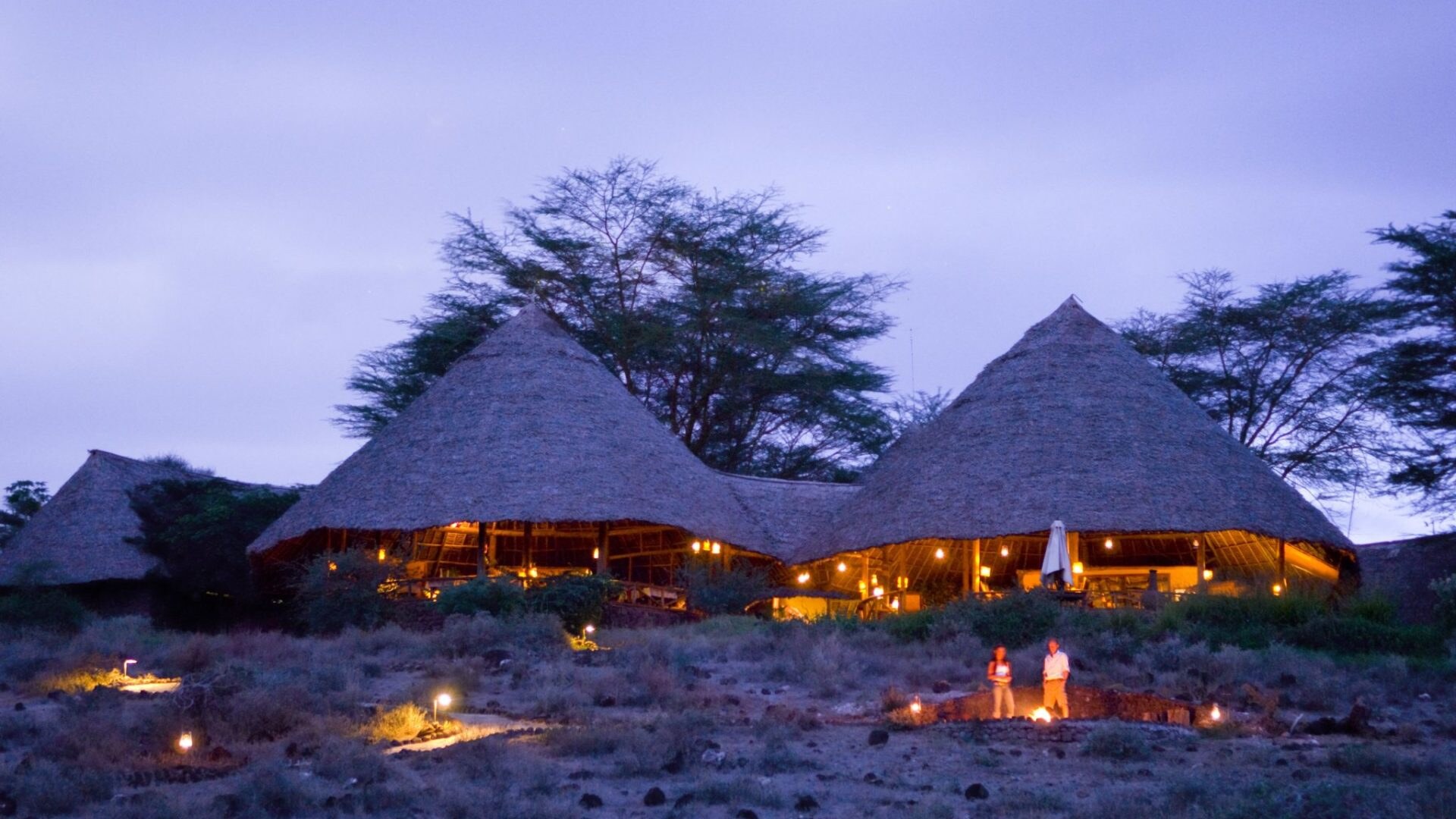 Tortilis Camp at dusk with Mount Kilimanjaro silhouette — Amboseli National Park, Kenya