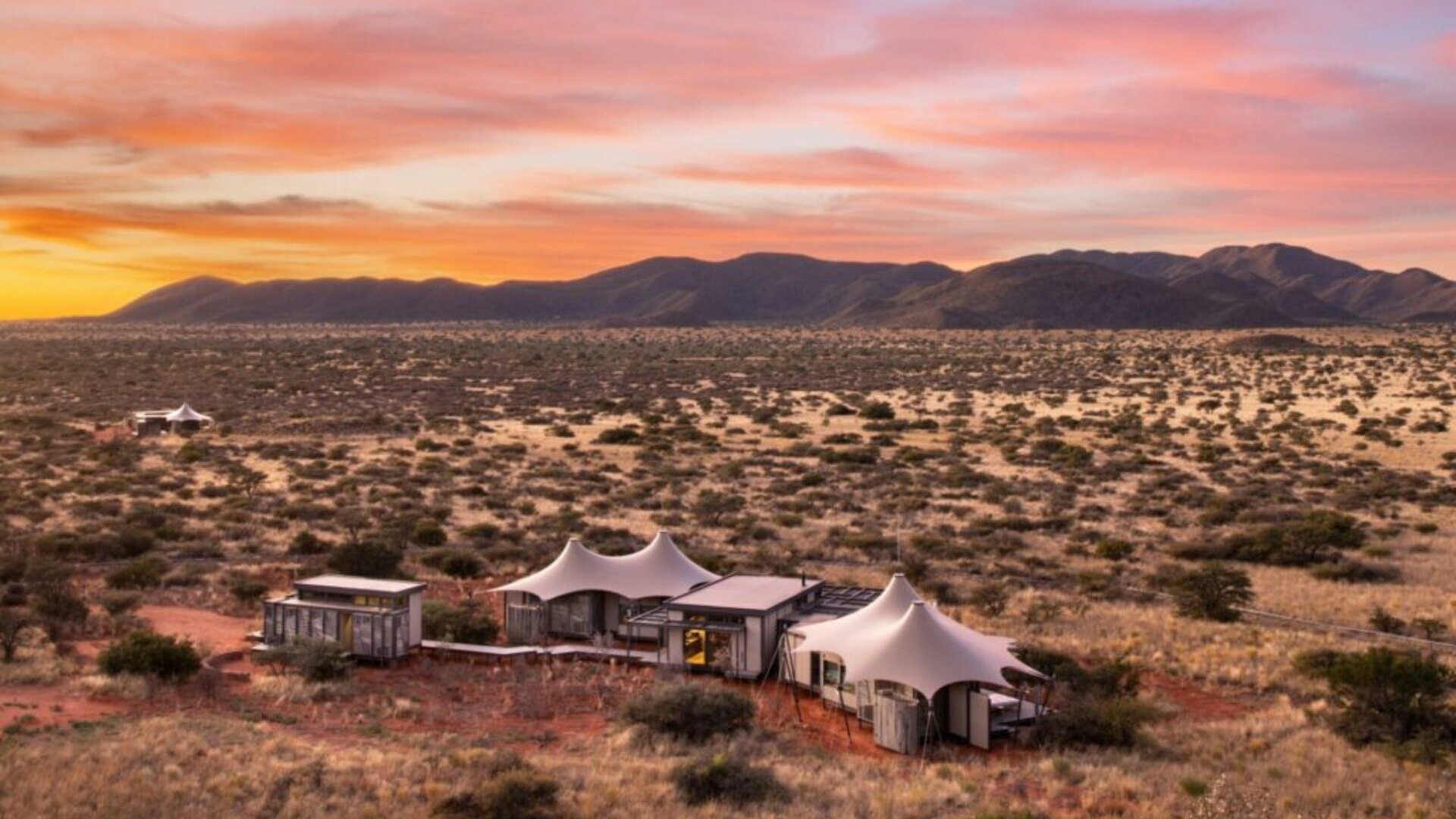 Loapi camp at sunrise overlooking the vast Kalahari landscape at Tswalu Reserve