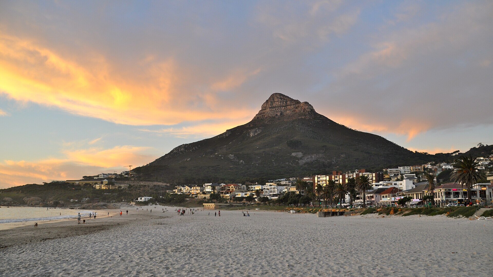 Table Mountain glowing above the Cape Town City Bowl and harbour at golden hour