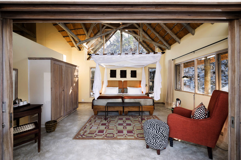 The private waterhole and bush setting at Ongava Tented Camp near Etosha
