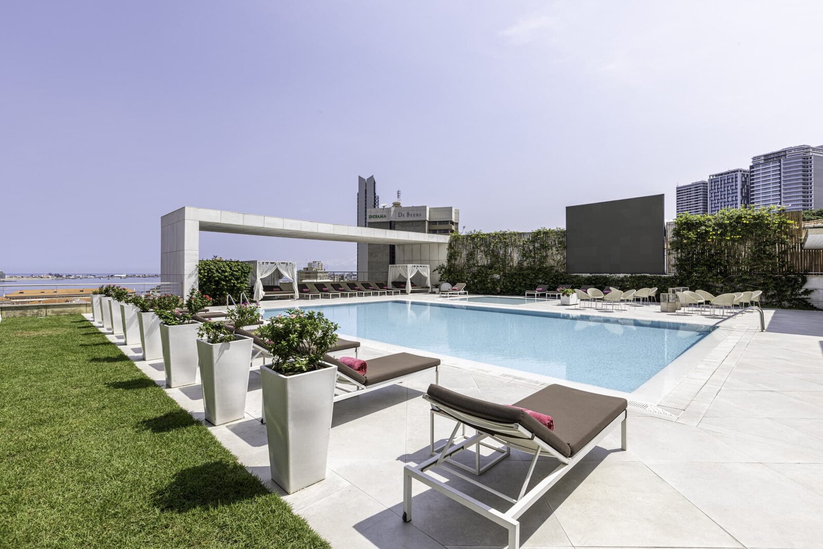 EPIC SANA Luanda rooftop pool overlooking the city — Angola safari gateway hotel