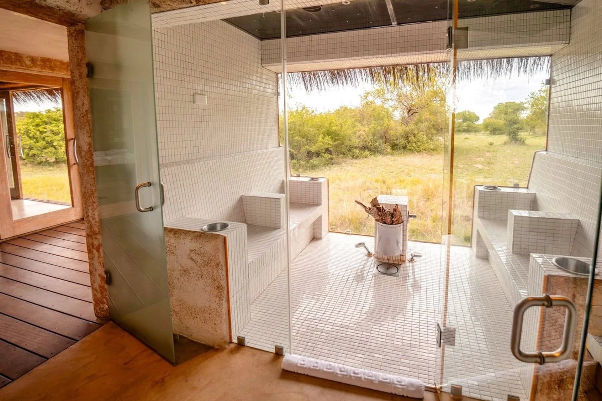 Infinity pool at a five-star South African safari lodge overlooking the bushveld at sunset — luxury safari packages South Africa 2026