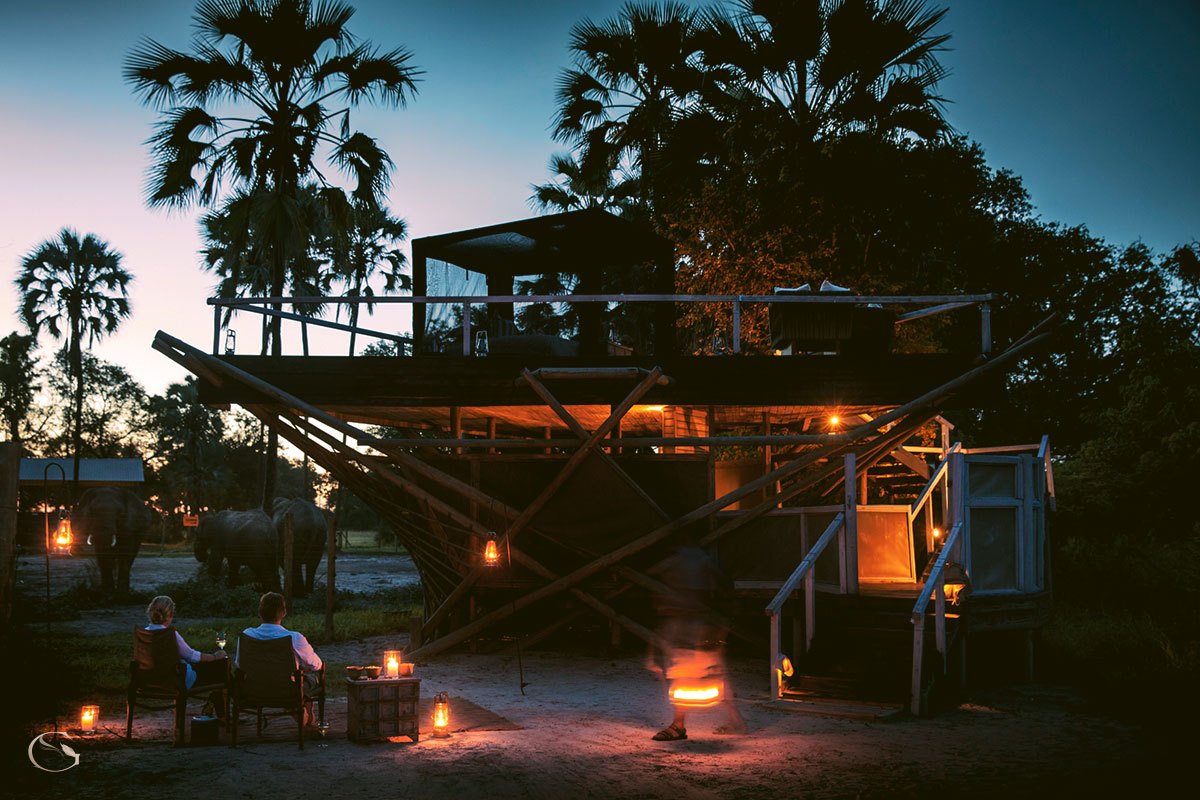 Abu Camp luxury tented suite beside an Okavango Delta lagoon