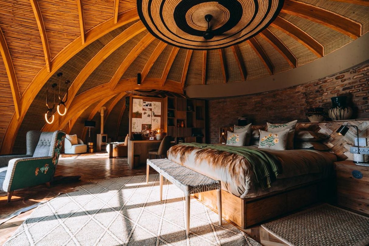 Spherical thatched villa in the volcanoes at Bisate Lodge, Rwanda