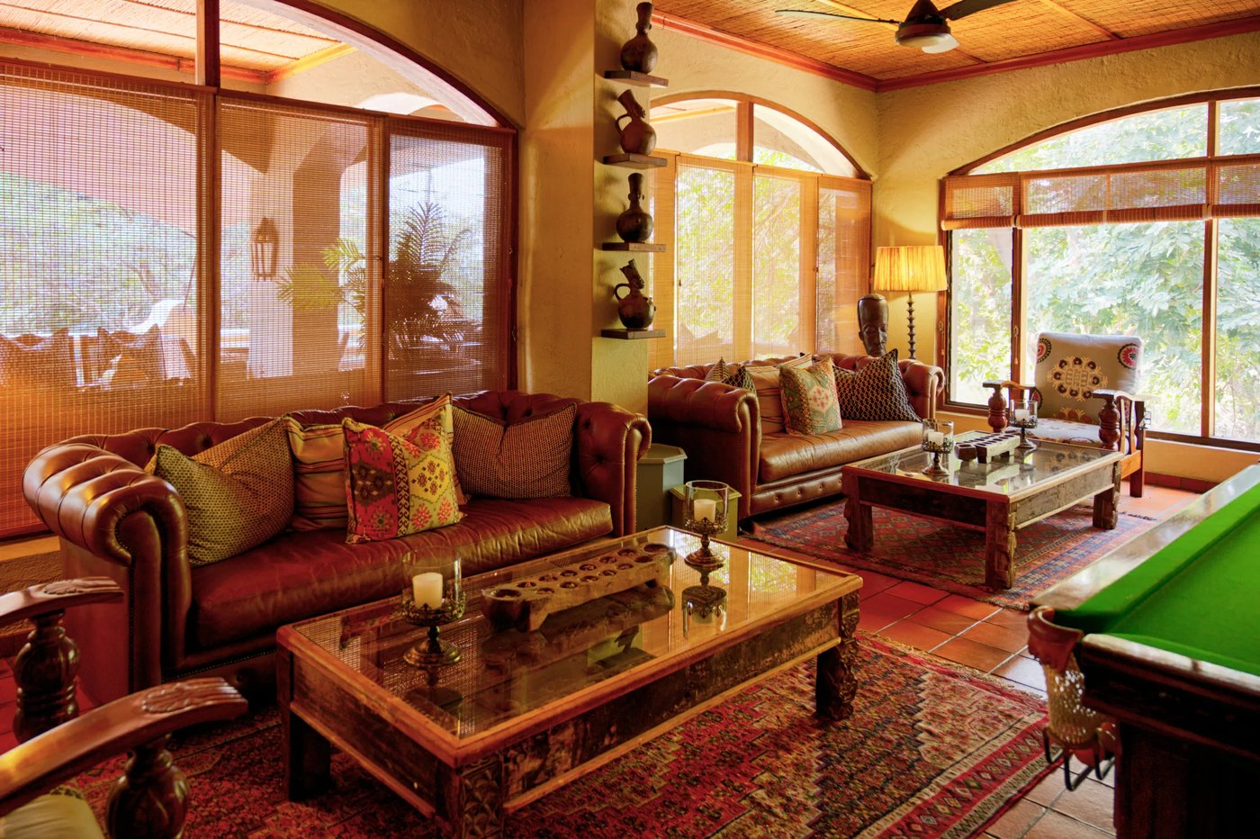 Chobe Game Lodge Moorish-styled lounge and bar with arched windows framing the Chobe riverfront