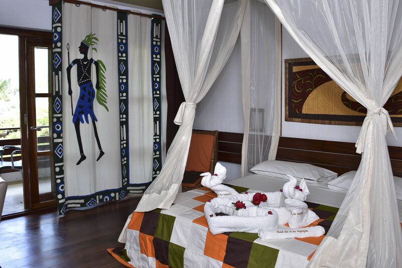 Hotel Club du Lac Tanganyika lakefront exterior at golden hour