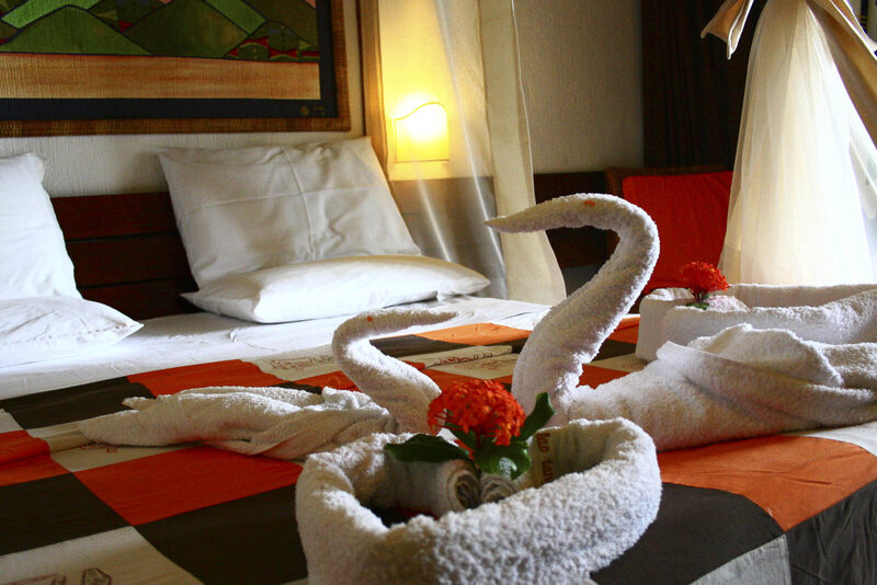 Suite bedroom with lake view at Hotel Club du Lac Tanganyika