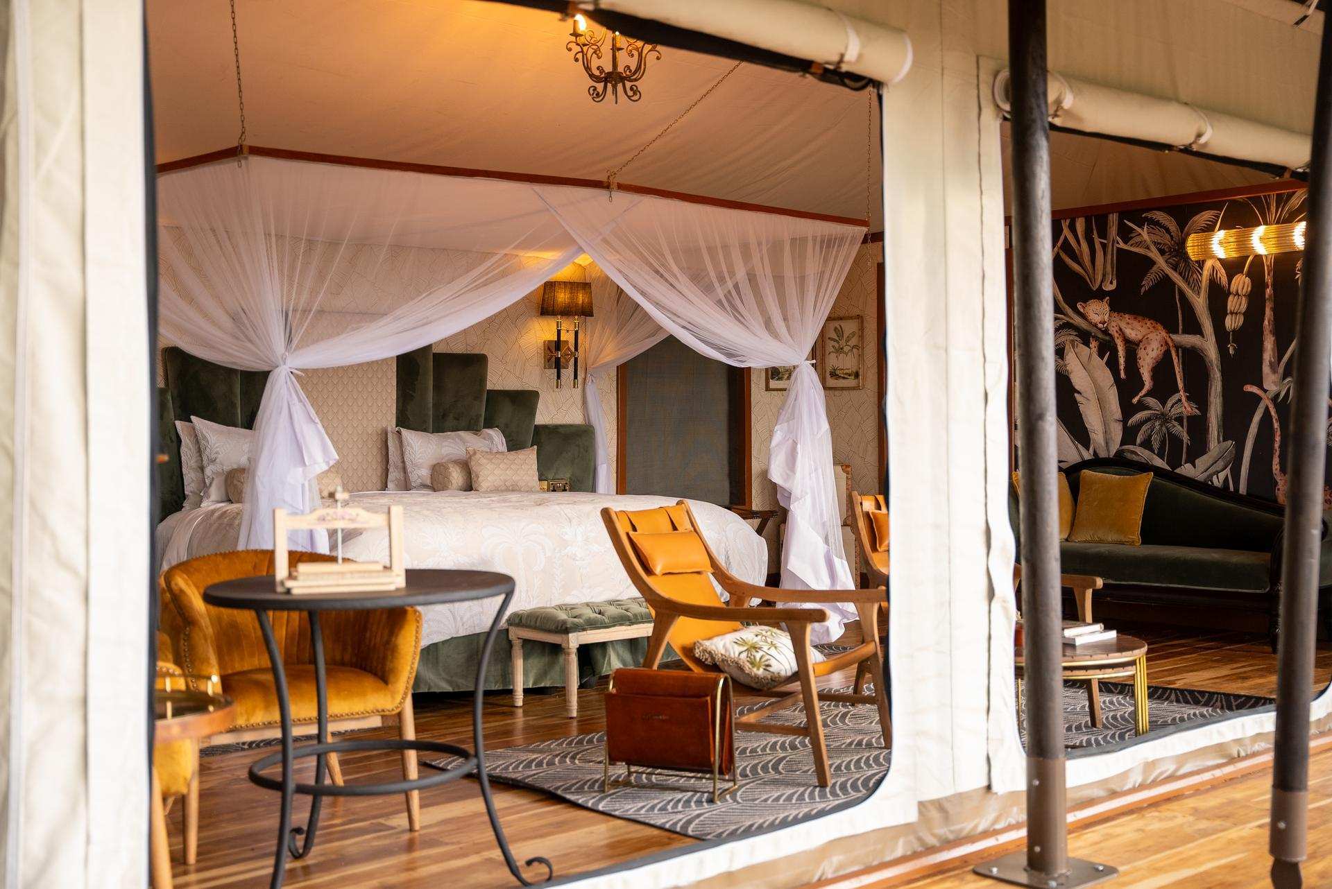 Cottar's 1920s Safari Camp vintage canvas tents at sunset in the Olderkesi Conservancy, Masai Mara, Kenya