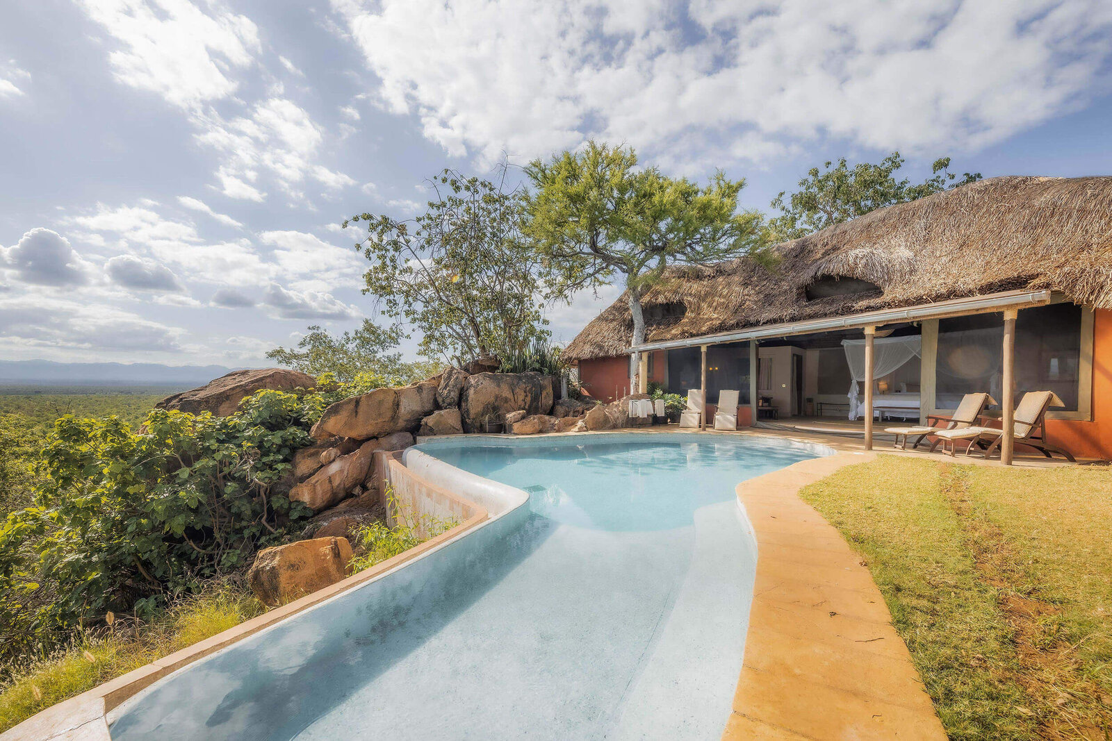 Elsa's Kopje infinity pool overlooking the Meru wilderness at sunset, Kenya