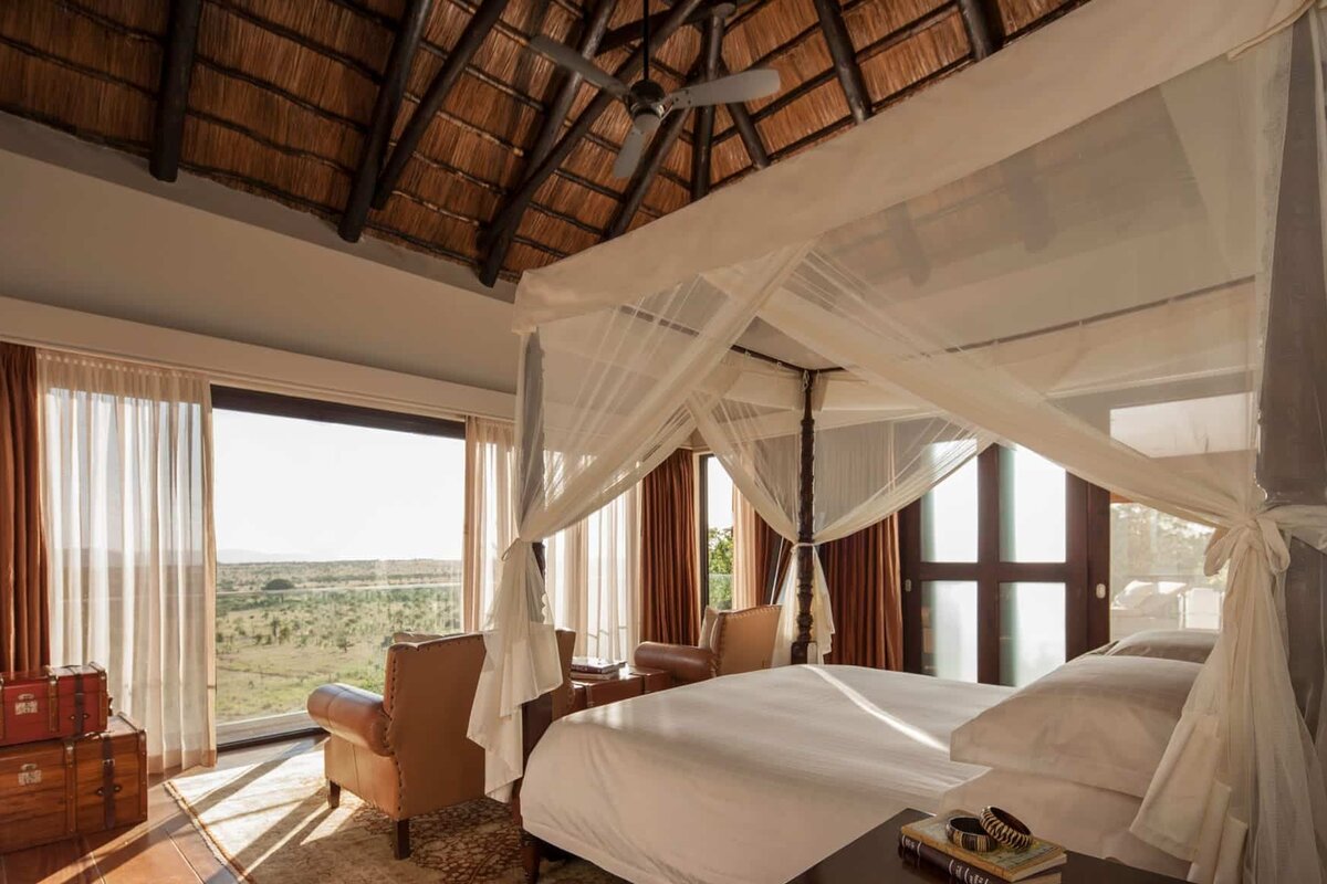 Four Seasons Safari Lodge Serengeti safari suite with thatched roof and savannah views