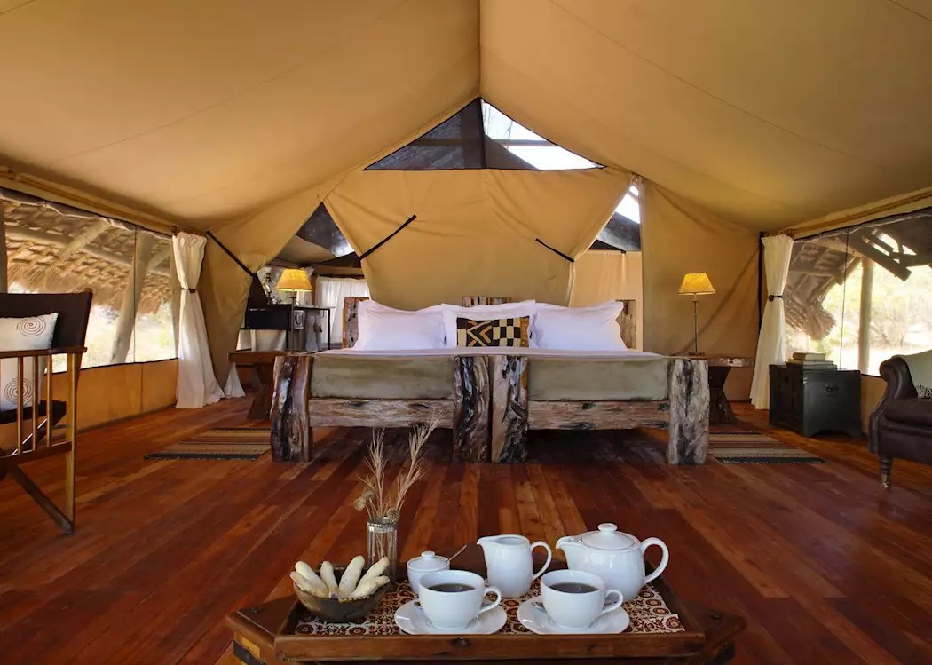 Private deck at Jongomero Camp overlooking sand river and baobab forest