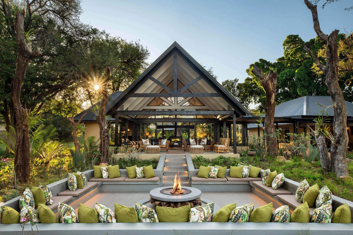 Sunken boma fire pit and lounge at dusk, Kings Camp, Timbavati