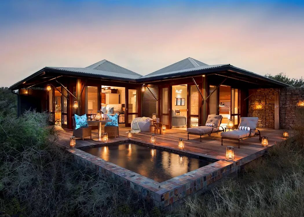 Kwandwe Ecca Lodge with private plunge pool and deck at dusk, Eastern Cape