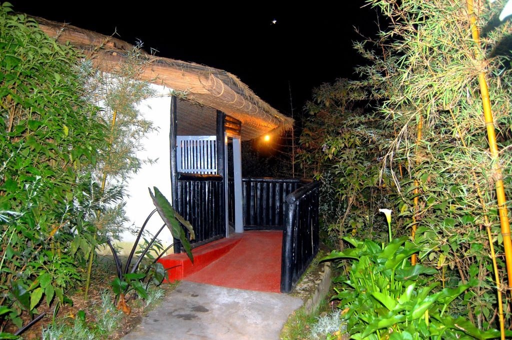 Le Bambou Gorilla Lodge lounge and fireplace in Kinigi