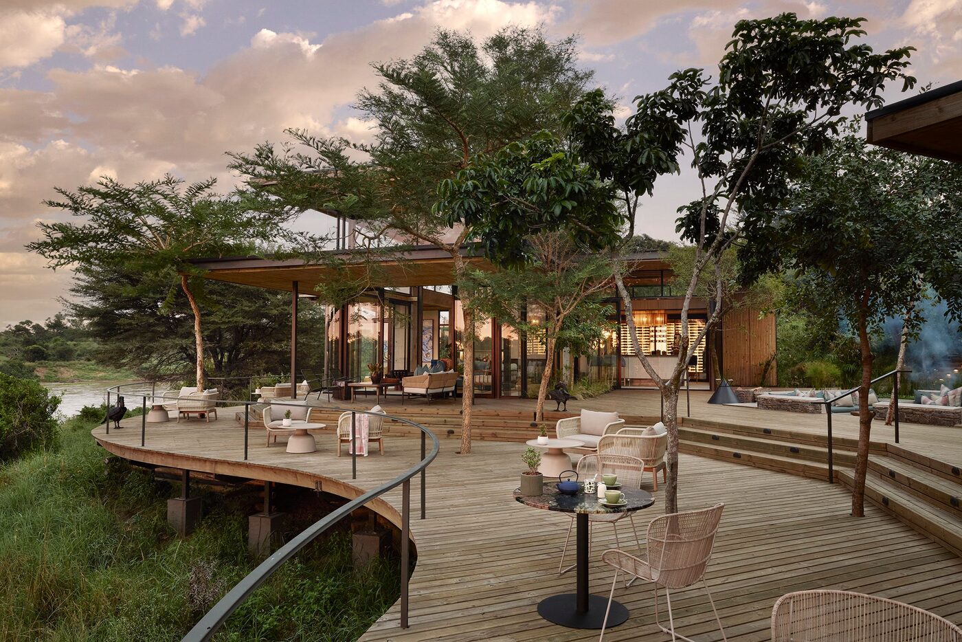 Main deck lounge overlooking the Sabie River at dusk, Lion Sands, Sabi Sand
