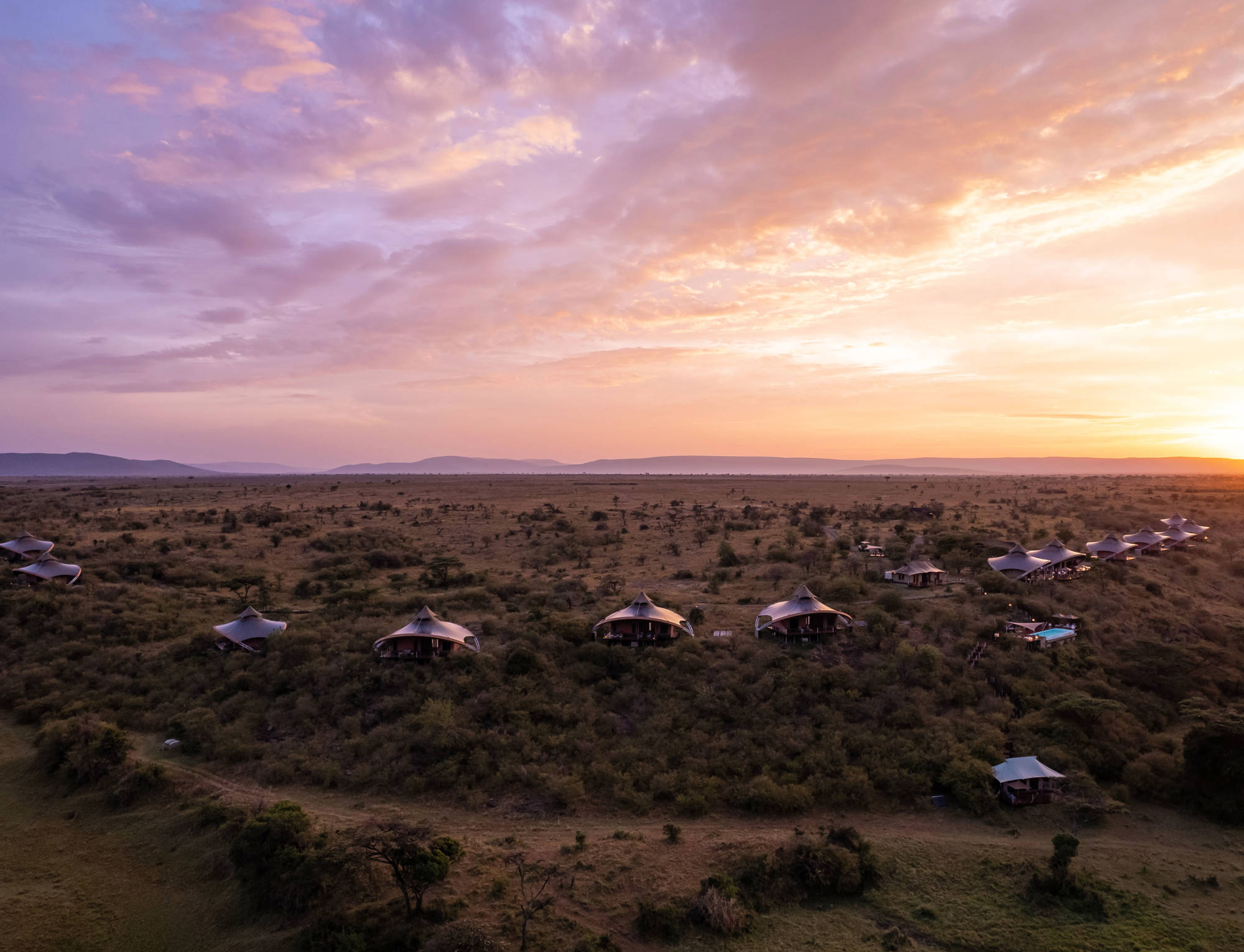 Mahali Mzuri luxury tented camp on a ridge at sunset in the Olare Motorogi Conservancy, Masai Mara, Kenya