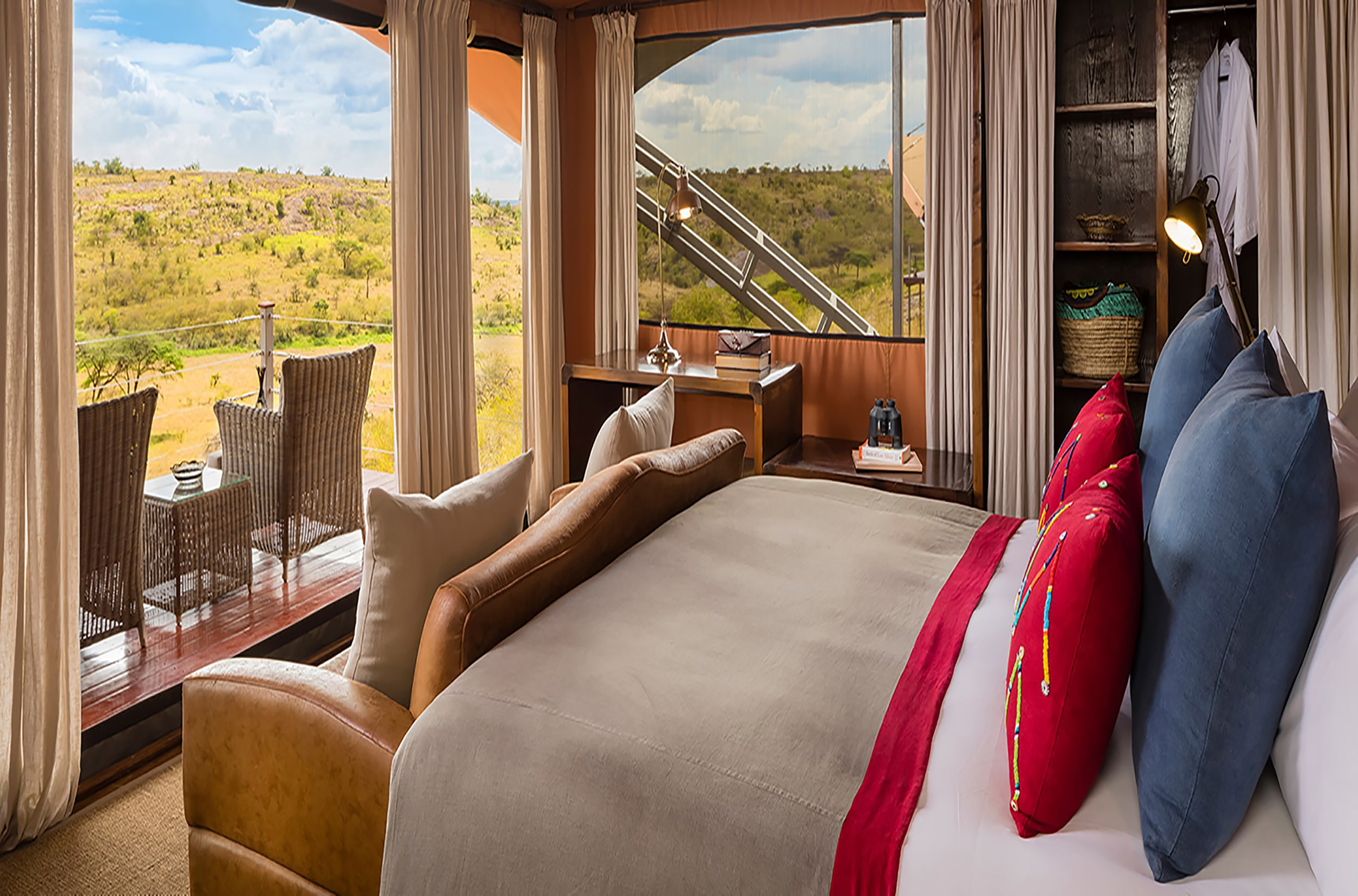 Private tent deck at Mahali Mzuri at sunrise with Mara plains views