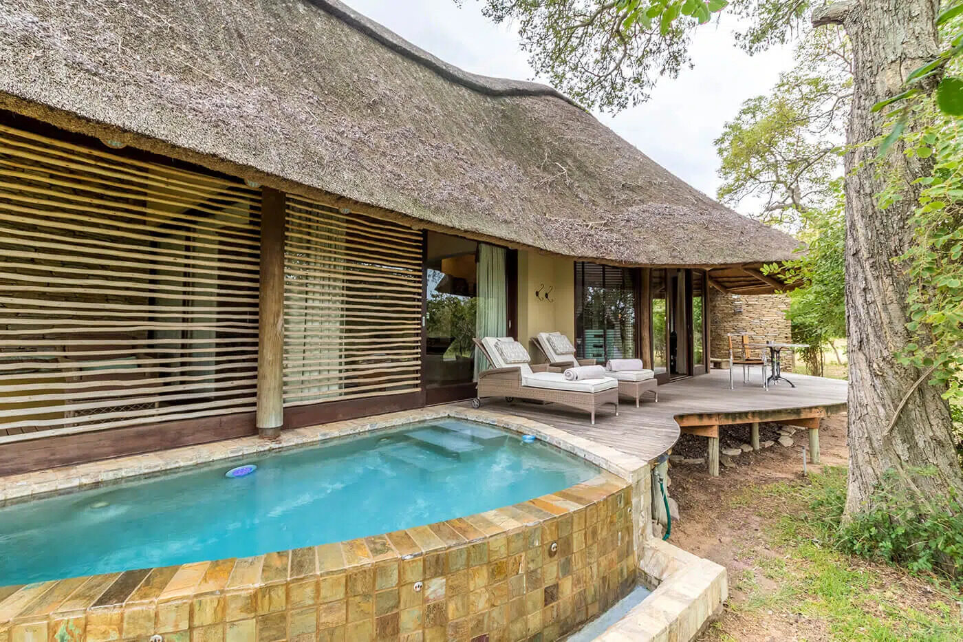 Suite exterior with loungers at Makanyi Private Game Lodge