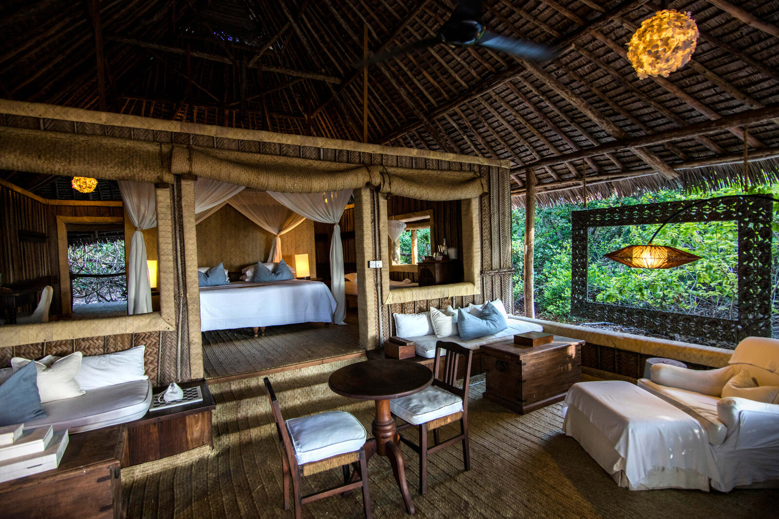 andBeyond Mnemba Island beach suite interior opening to the Indian Ocean, Zanzibar