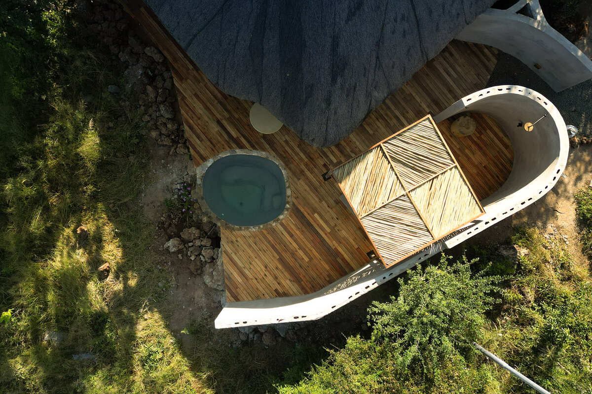 Ngoma Safari Lodge suite aerial view with private plunge pool and curved timber deck above the Chobe escarpment