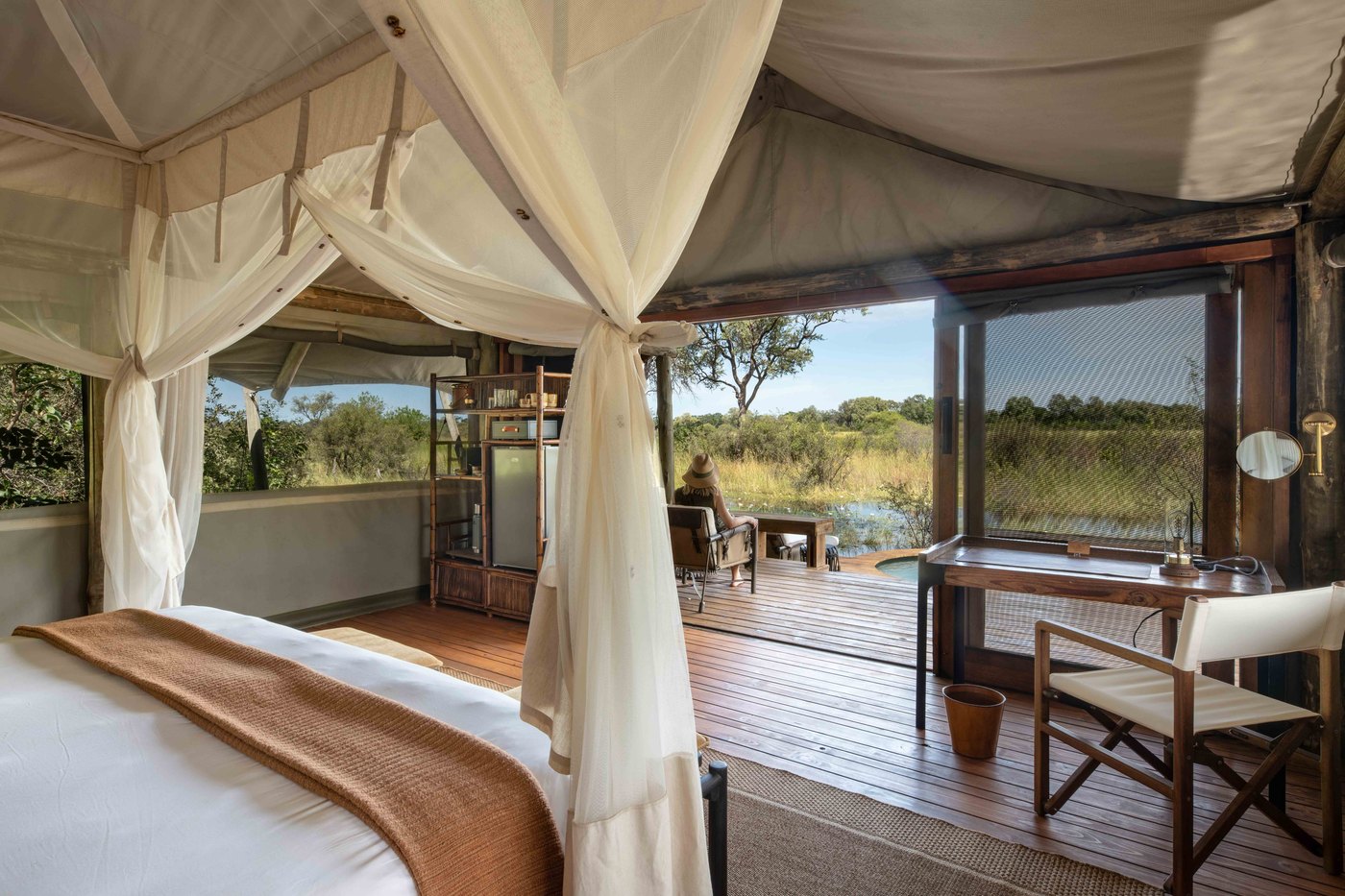 Raised wooden walkway and canvas suites in the Okavango Delta
