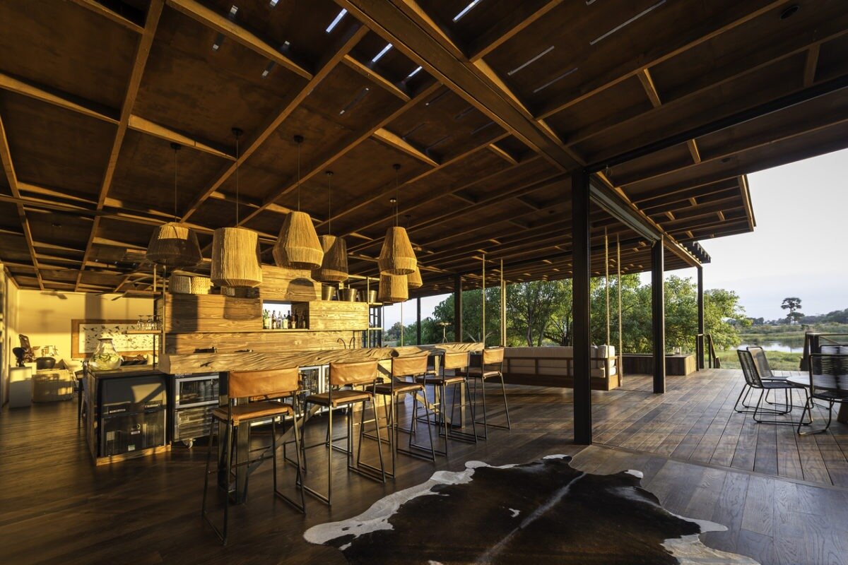 Qorokwe Camp open-sided bar and dining deck with delta views and designer safari interiors