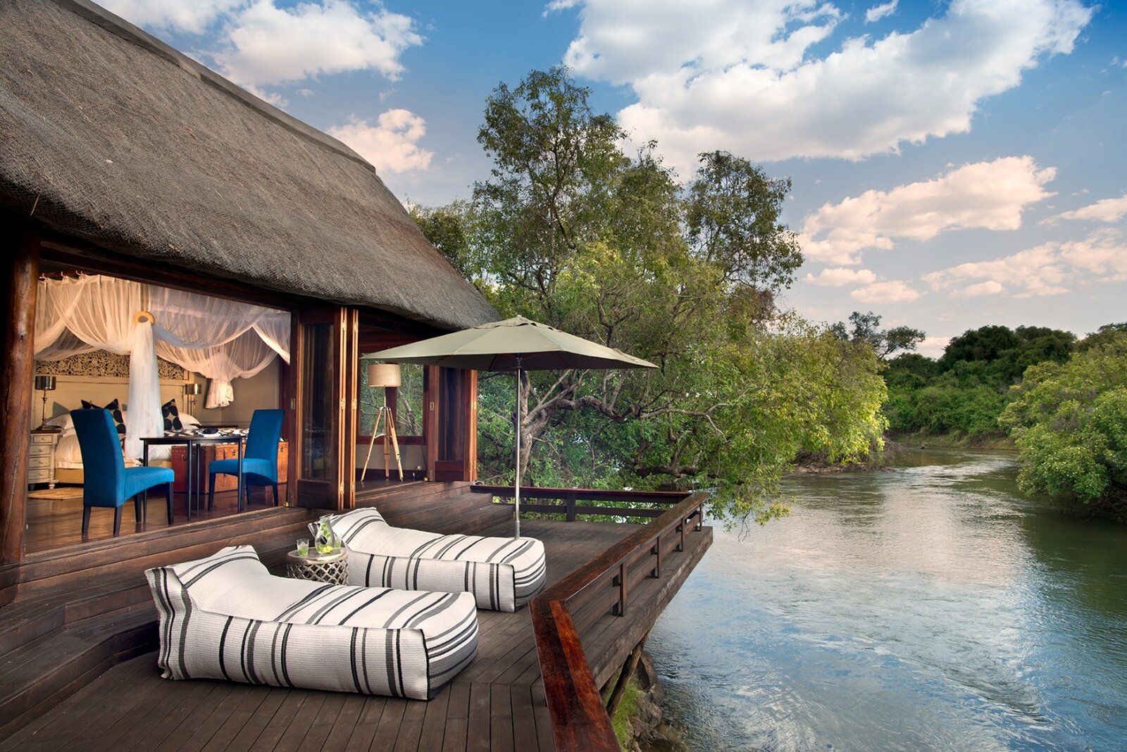 Royal Chundu riverfront suite and deck overlooking the Zambezi River near Victoria Falls, Zambia