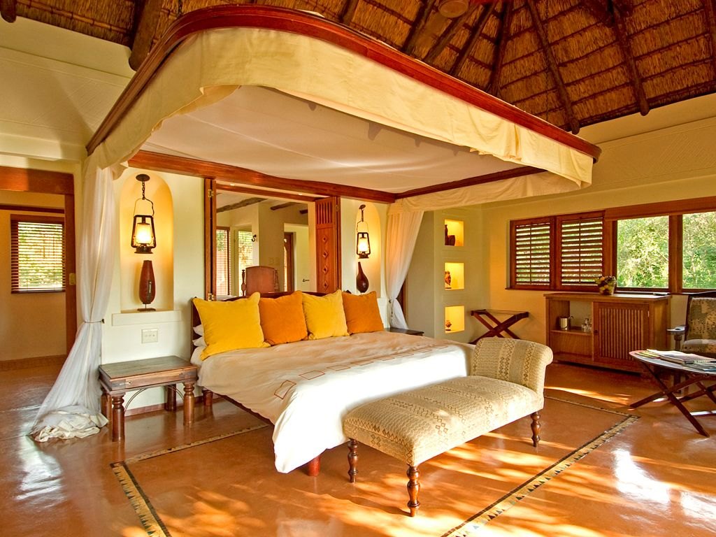 Sanctuary Chobe Chilwero — suite interior and private deck