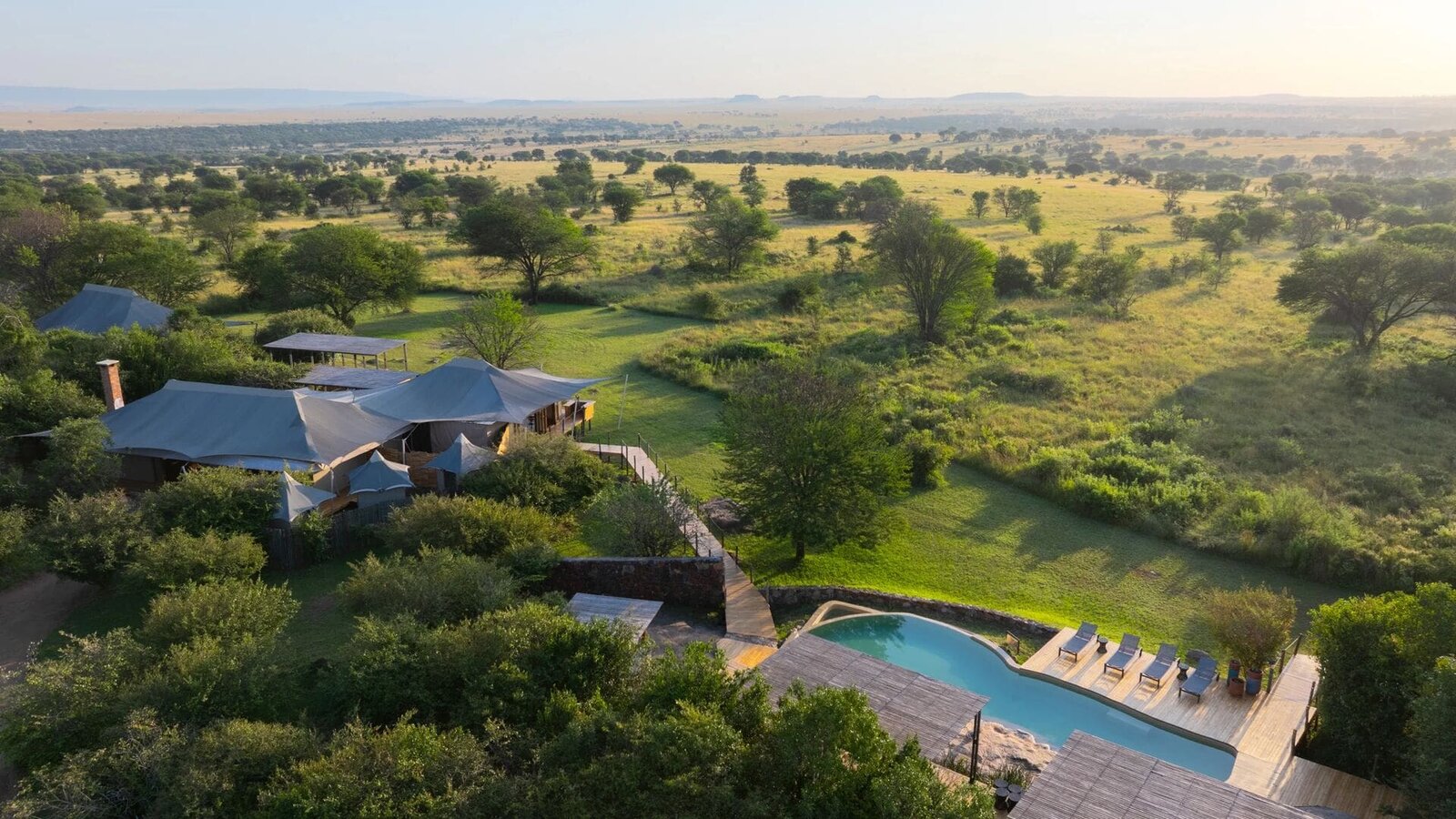 Aerial view of Sayari Camp with its rim-flow pool set among the Kogatende woodland