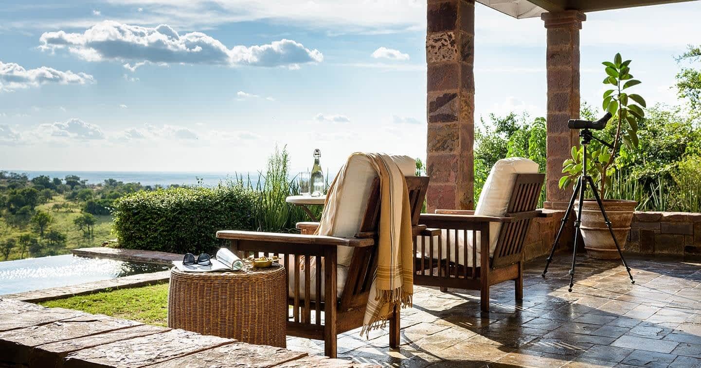 A four-poster bedroom suite at Singita Sasakwa Lodge, Grumeti Reserve, Western Serengeti