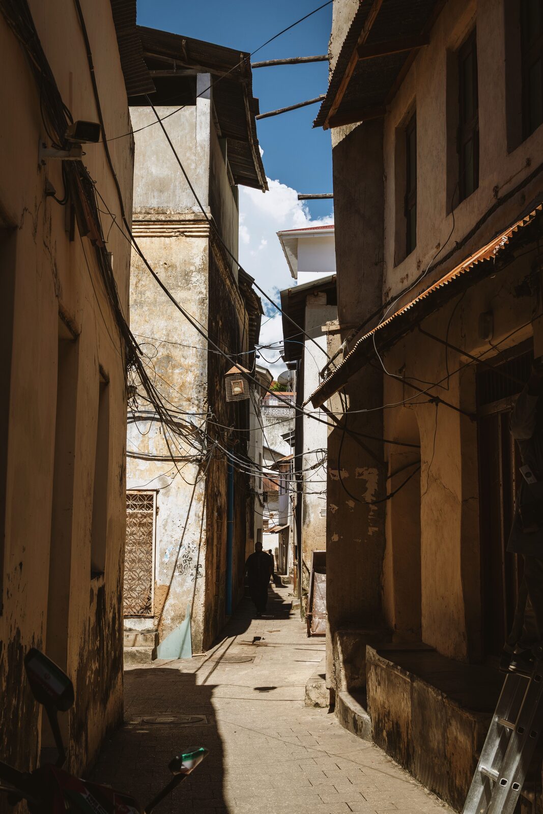 Narrow coral-ragstone alley in historic Stone Town UNESCO quarter