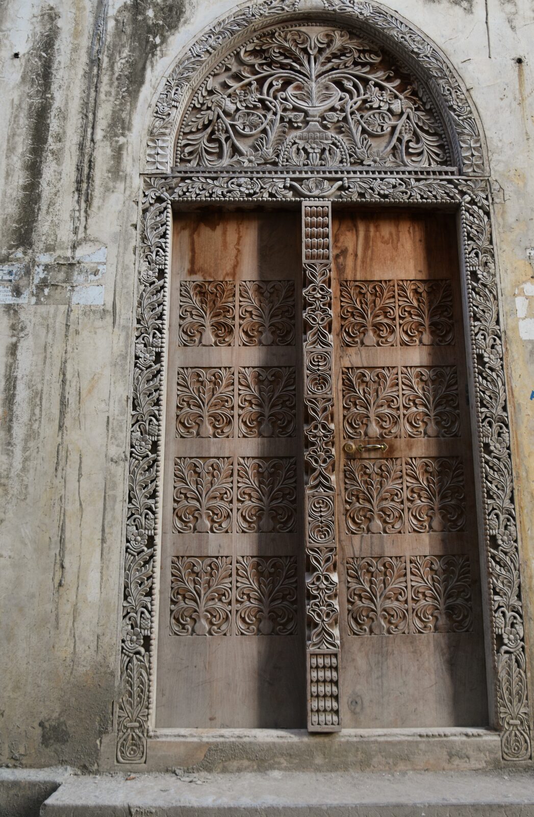 Carved wooden door with brass studs, Stone Town UNESCO heritage